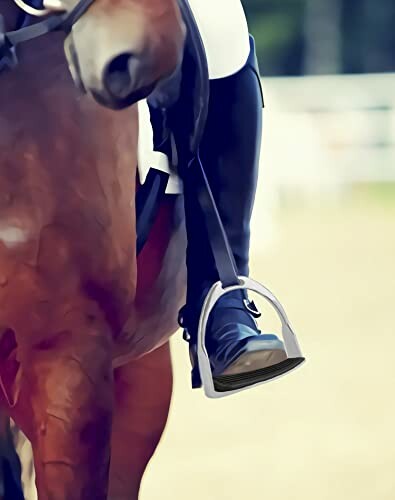 Close-up of a rider's boot in a stirrup on a horse.